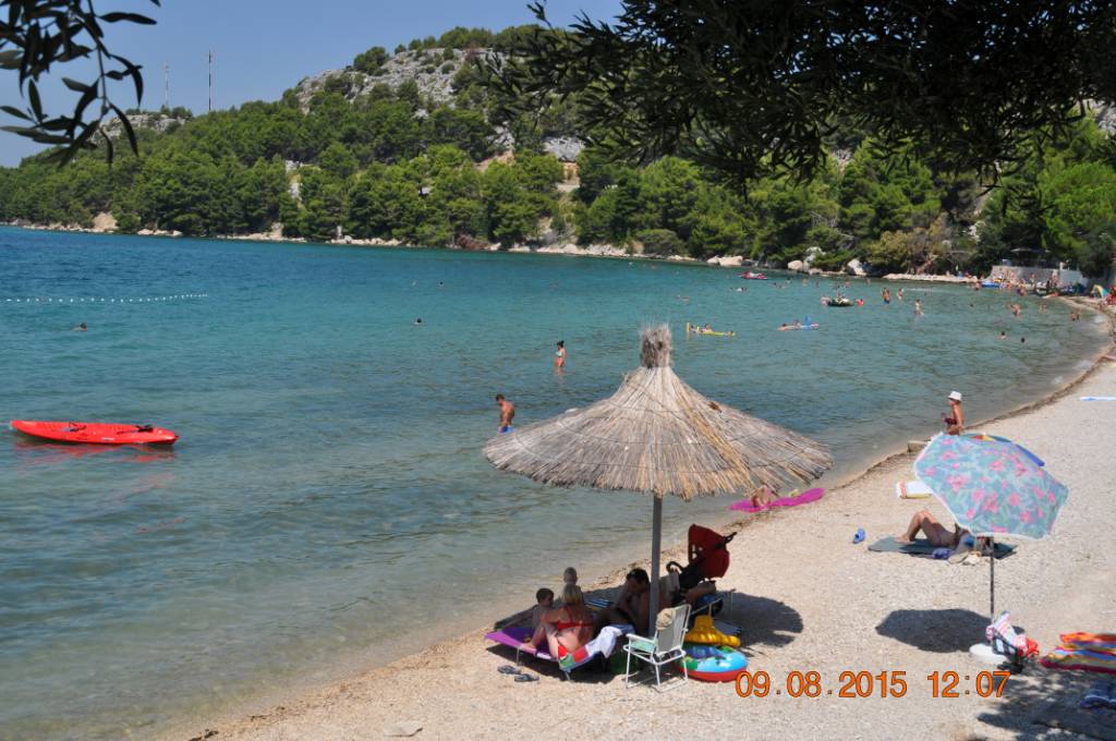 Sandy beach on the right of the house